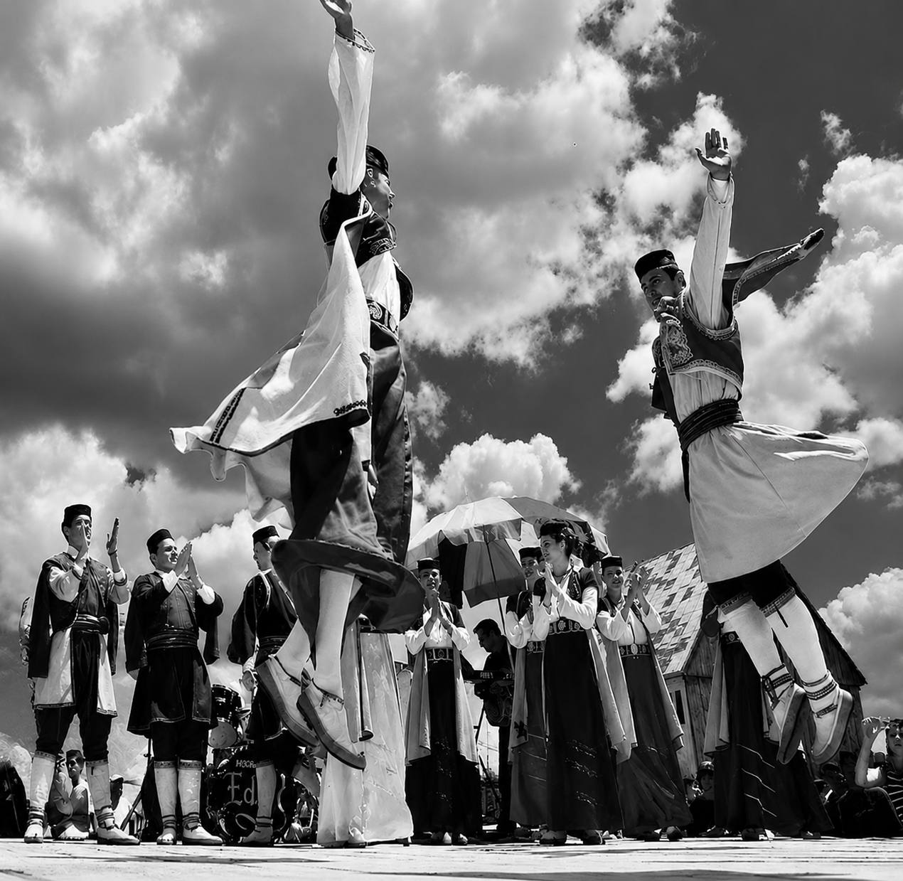 Montenegrin folk dancers mid-leap